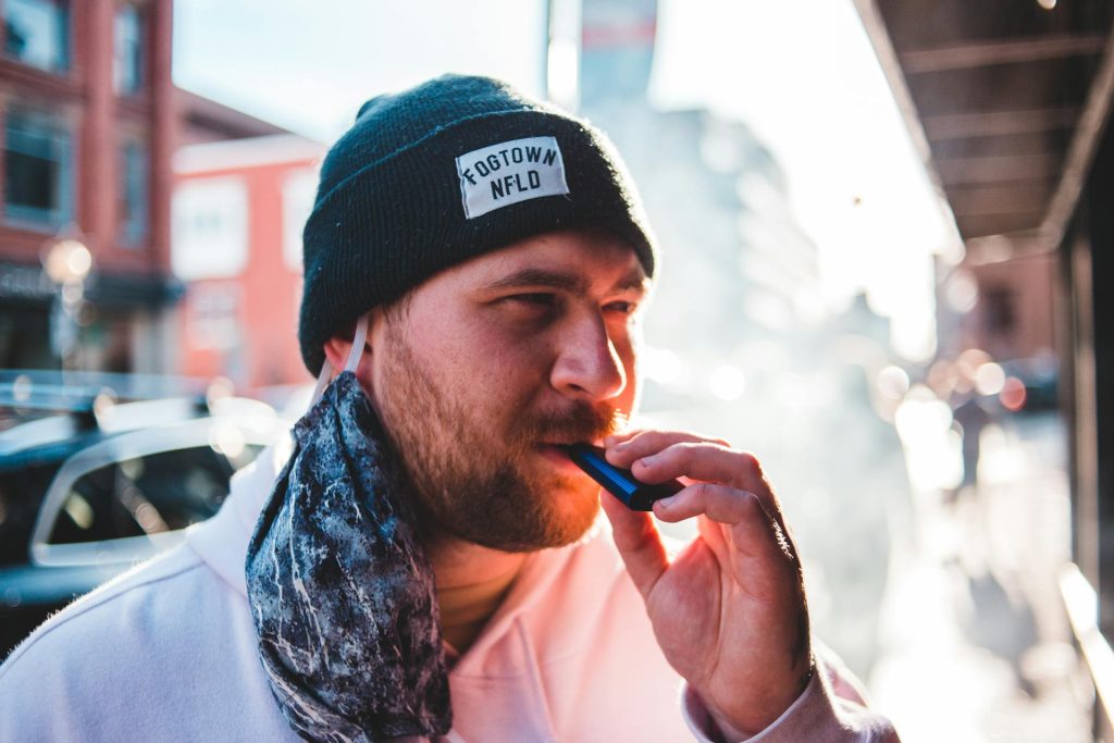 man smoking vape - featured image